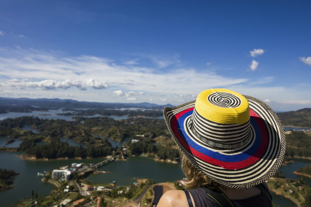 Young woman at Guatape lake in Antioquia, Colombia